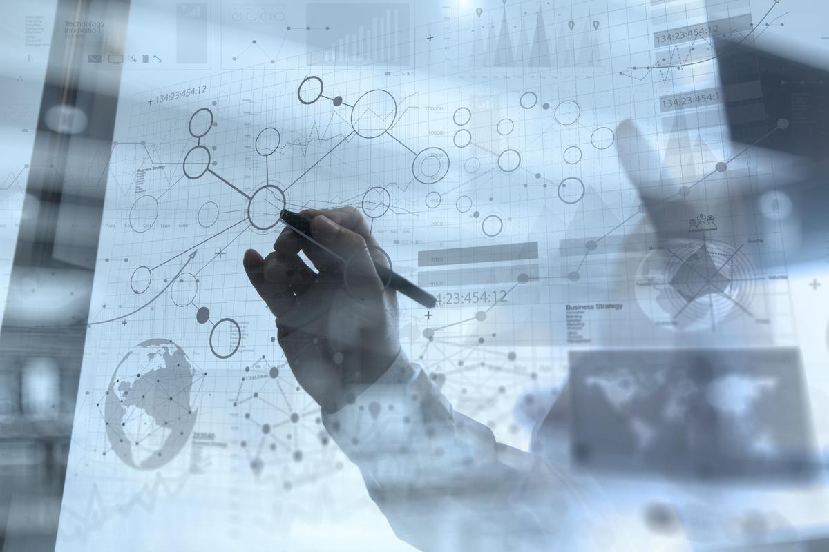 Man working on digital technology diagram